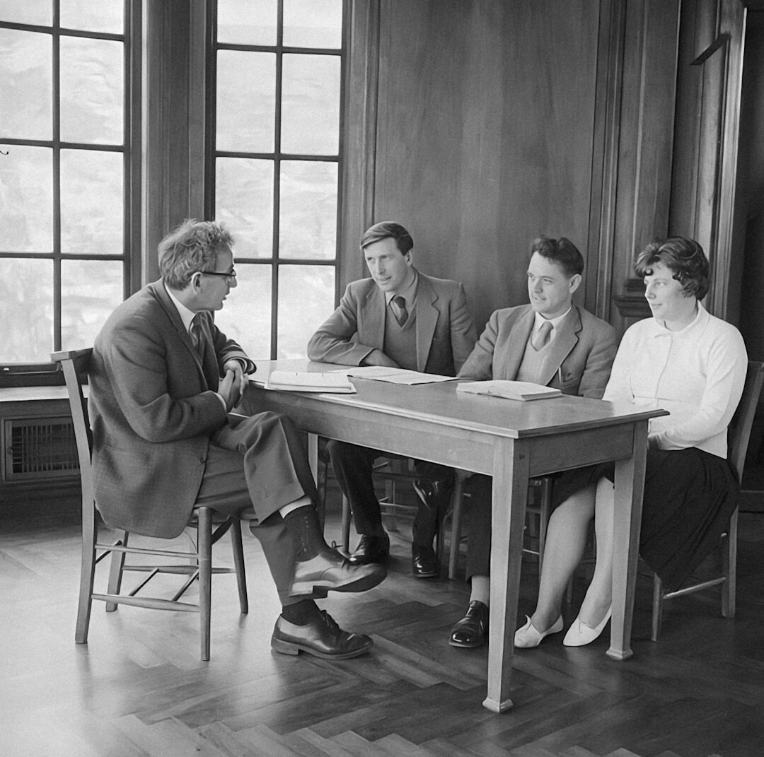 Diverse team of media trainers discussing around a table
