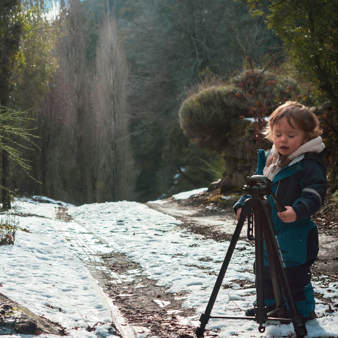 Small film crew filming a reporter on location
